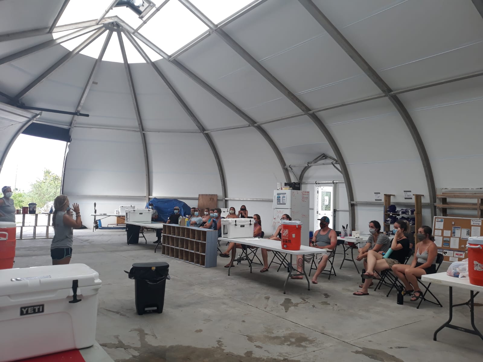 Inside the cavernous work tent for the All Hands and Hearts team.