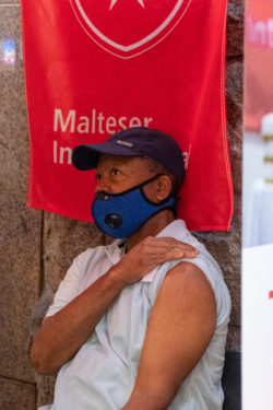 A man holds out his arm in the Malteser International Americas Flu Vaccine Clinic this past Thursday.