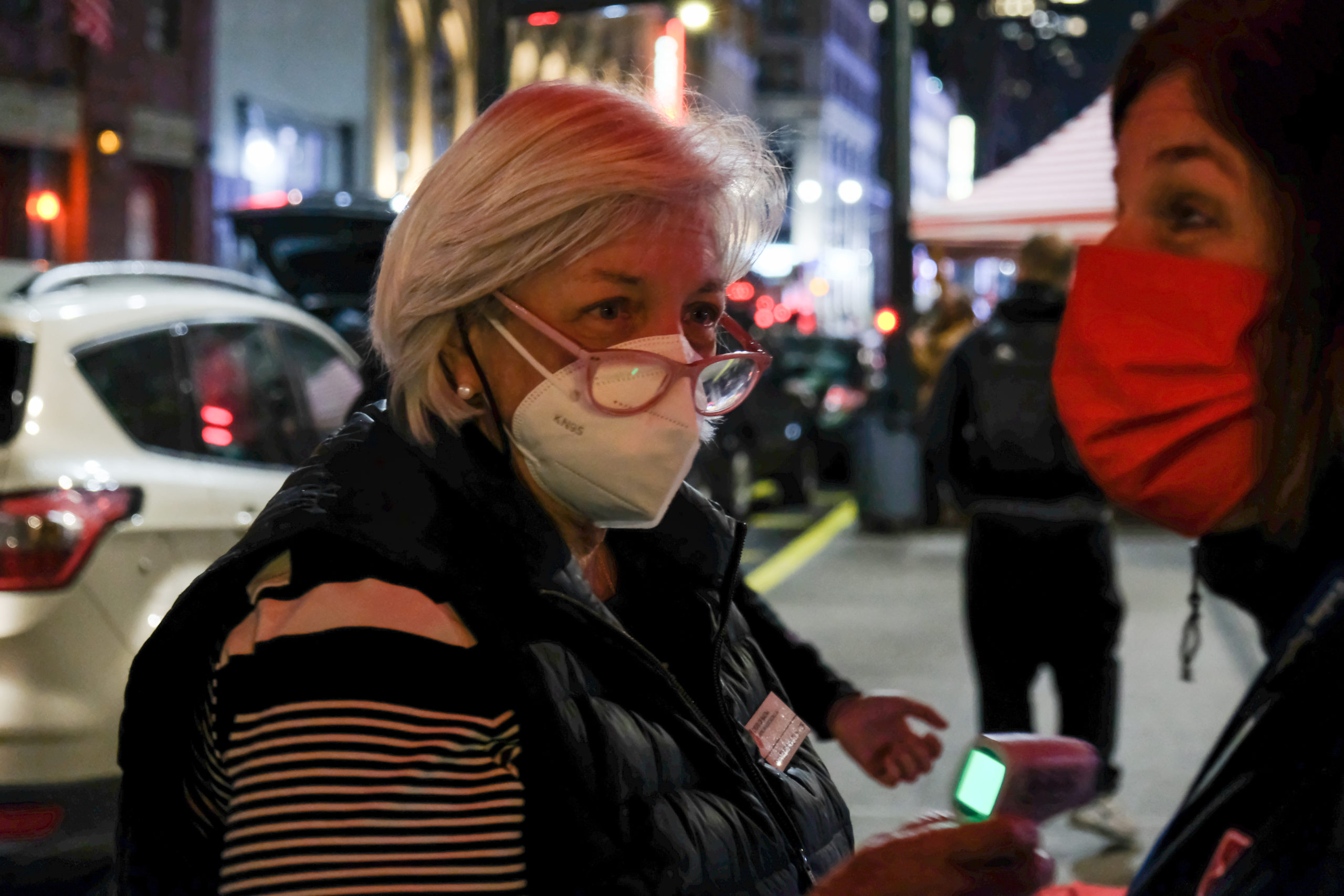 A nurse tests a thermometer at the Malteser International Americas Flu Clinic.