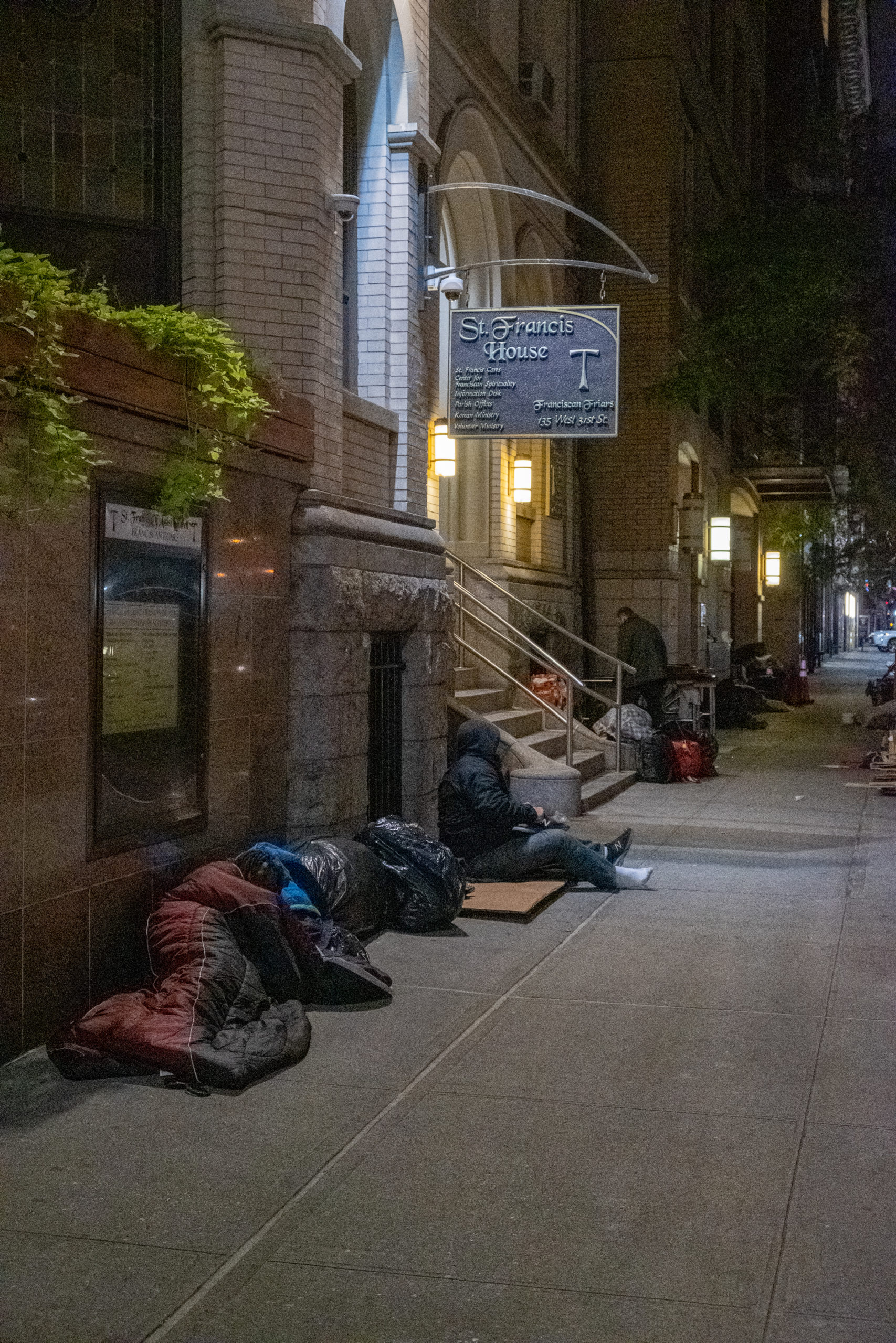 The beneficiaries of the St. Francis Breadline sleeping in front of the church upon our arrival.